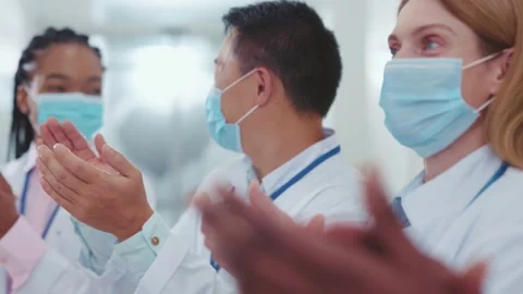 Multi-ethnic group of doctors, physicians and nurses wearing respiratory mask Stock Footage 142590855