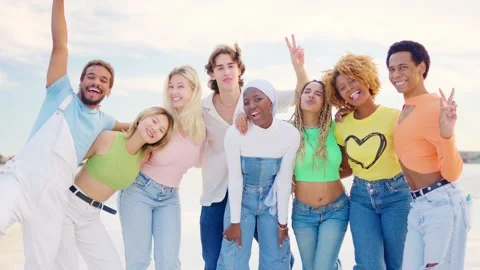 Multi-ethnic group of friends embracing and smiling at camera Stock Footage 265018128