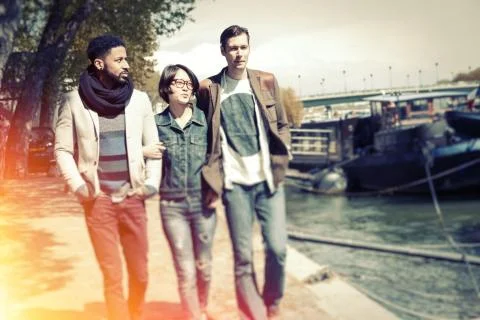 Multi-ethnic Group Of Friends Having Fun In Paris Along Seine Foto stock