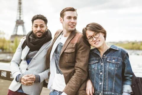 Multi-ethnic Group Of Friends Having Fun In Paris Along Seine Stock Photos