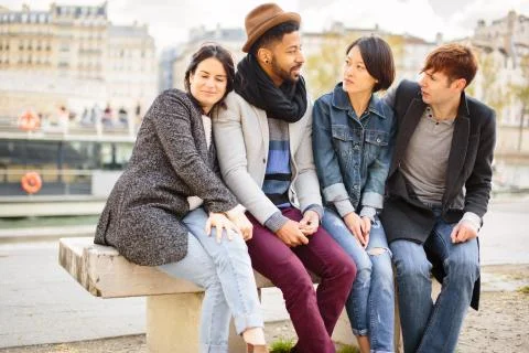 Multi-ethnic Group Of Friends Having Fun In Paris Along Seine Foto stock