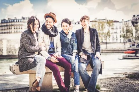 Multi-ethnic Group Of Friends Having Fun In Paris Along Seine Photos