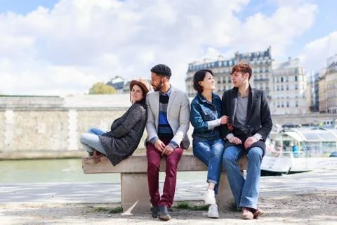 Multi-ethnic Group Of Friends Having Fun In Paris Along Seine Foto stock