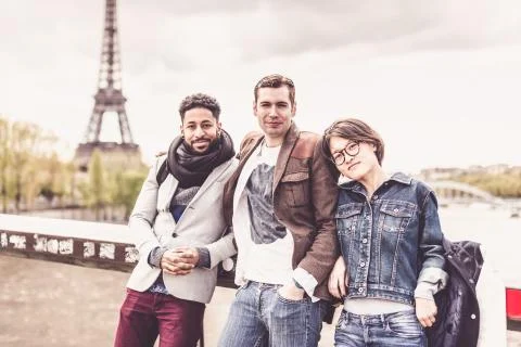 Multi-ethnic Group Of Friends Having Fun In Paris Along Seine Foto stock