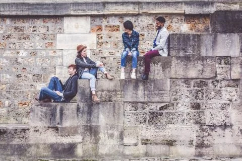 Multi-ethnic Group Of Friends Having Fun In Paris Along Seine Stock Photos