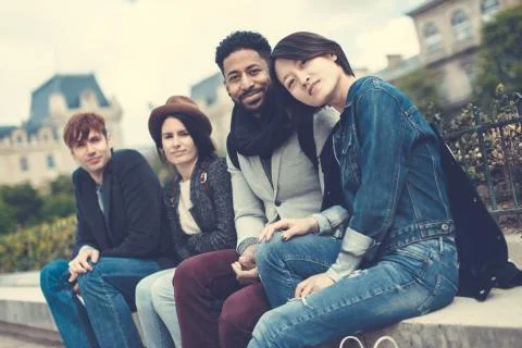 Multi-ethnic Group Of Friends Having Fun In Paris, Notre Dame Foto stock