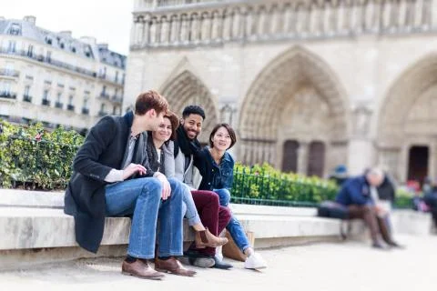 Multi-ethnic Group Of Friends Having Fun In Paris, Notre Dame Foto stock