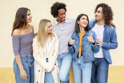 Multi-ethnic group of friends posing while having fun and laughing together Stock-Fotos