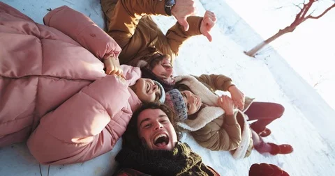 Multi ethnic group of friends take a selfie video they laying down on the floor Stock Footage 112622532