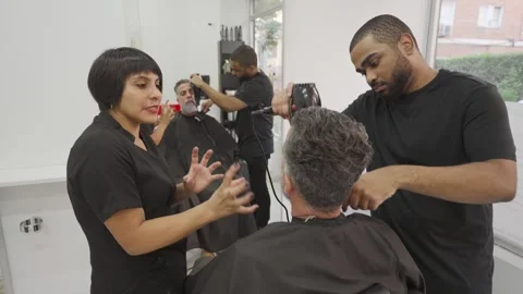 Multi ethnic group mixed age in hairdressing salon professional beard dyeing.MOV Stock Footage 255795867