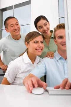 Multi ethnic group of people looking computer Stock Photos