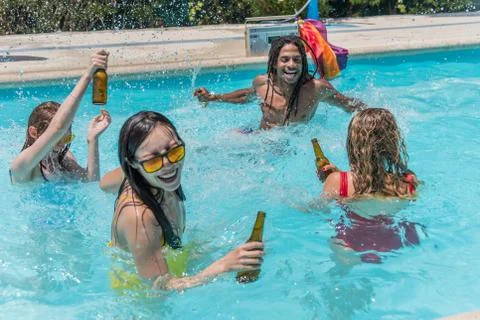 Multi-ethnic group at a pool party drinking and having fun You can see the LGBT Stock Photos