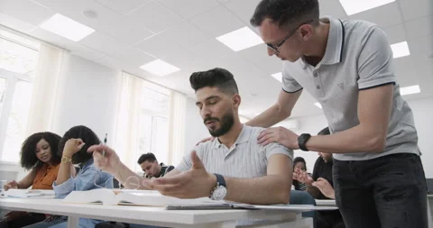 Multi ethnic group of students working on task together. Group of diversity Stock Footage 137300208