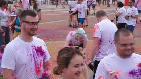 Multi ethnic group of teens celebrating holi festival color run Vidéo 110893205