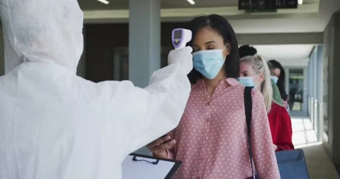 Multi-ethnic group working in casual office, in face mask protecting from Covid Stock Footage 164009324