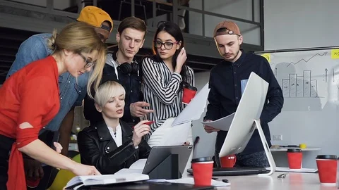 Multi ethnic group of young hipster people discussing business ideas. Stock Footage 108326903