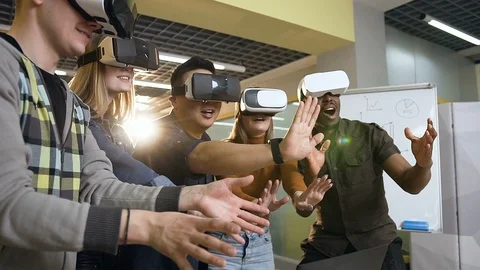 Multi ethnic hipster group having fun using vr virtual reality glasses. Stock Footage 113092829