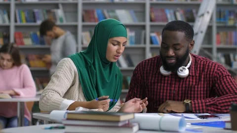 Multi ethnic interior designers working on sketch Stock Footage 101995316