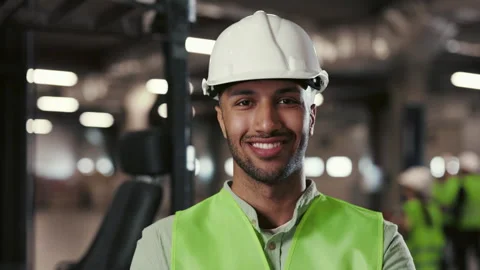 Multi-Ethnic Male Engineer Posing with Crossed Arms Standing in the Factory or Stock Footage 246428977