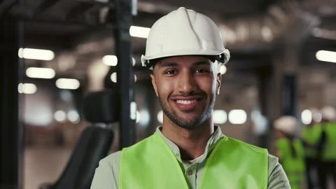 Multi-Ethnic Male Engineer Posing with Crossed Arms Standing in the Factory or 스톡 사진