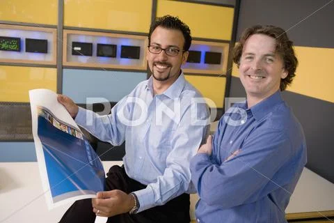 Multi-ethnic male graphic designers in office Stock Photos