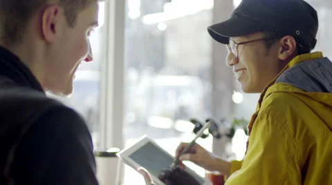 Multi-Ethnic Man Draws On A Tablet, His Boyfriend Draws On It Too Video stock 47130682