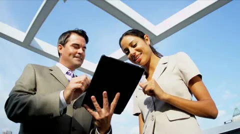 Multi ethnic managers planning investment banking using tablet Stock Footage