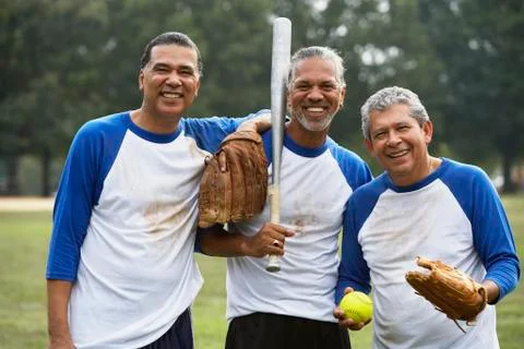Multi-ethnic men with baseball gear Stock Photos