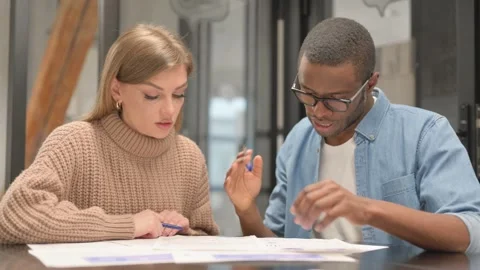 Multi Ethnic People Doing Paperwork Together Stock Footage 302872402