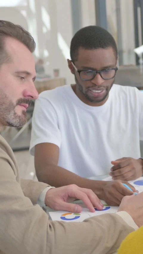 Multi Ethnic People Doing Paperwork, Documents, vertical video Stock Footage 324694423