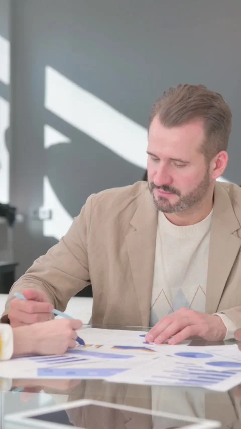 Multi Ethnic People Doing Paperwork, Documents, vertical video Video stock 324702898