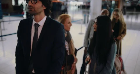 Multi-ethnic people waiting in queue at airport 스톡 동영상 90339243