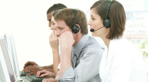 Multi-ethnic people working in a call center Stock Footage 564398
