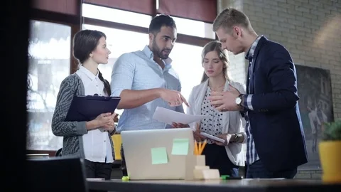 Multi-ethnic startup team is brainstorming and discussing new projects Stock Footage 73219830