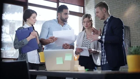 Multi-ethnic startup team is brainstorming and actively discussing new ideas Video stock 73220401