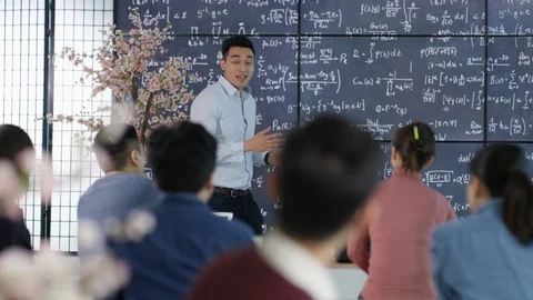Multi Ethnic students in classroom lecture with teacher Stock Footage 82364133