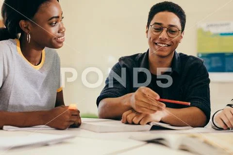 Multi-ethnic students studying together Stock Photos