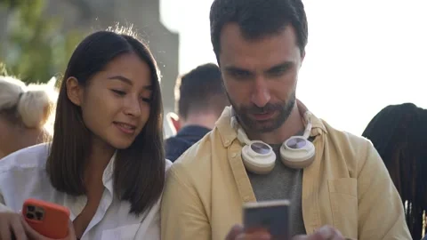 Multi-ethnic students using smartphones outdoor Stock Footage 163280261