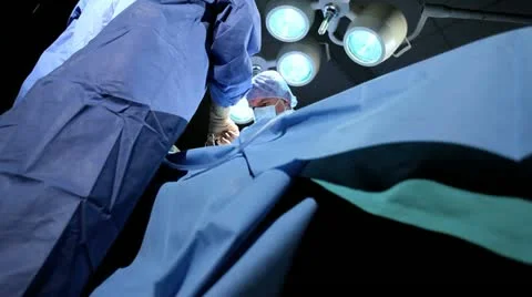 Multi Ethnic Surgical Team in Operating Theater Stock Footage 18745954