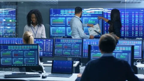 Multi-Ethnic Team is Busy Working at the Stock Exchange Office.  Stock Footage 81276569