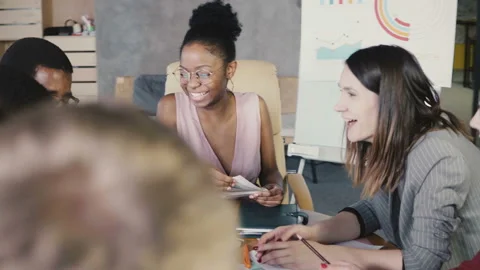 Multi ethnic team discussing creative strategy plans. Happy smiling office Stock Footage 87949828