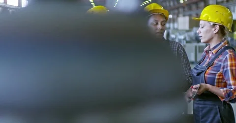 Multi-Ethnic Team of Female Supervisors Working at Factory Stock Footage