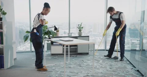 Multi-ethnic team of janitory services cleaning corporate office collecting Stock Footage 149263171