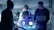 Multi Ethnic Team Of Male And Female Leading Scientists Work On Innovative Robot Stock Footage