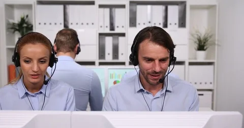Multi Ethnic Team of People Customer Service Representatives Talking on Headsets Stock Footage 80072741