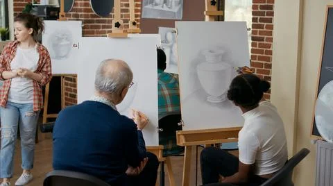 Multi ethnic team of people learning drawing technique together Stock Photos