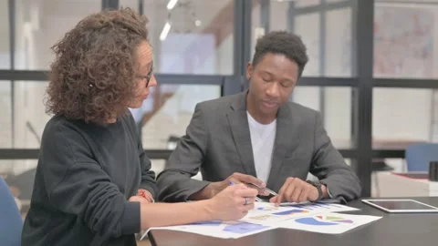 Multi Ethnic Teammates Doing Paperwork in Office Stock Footage 269773540