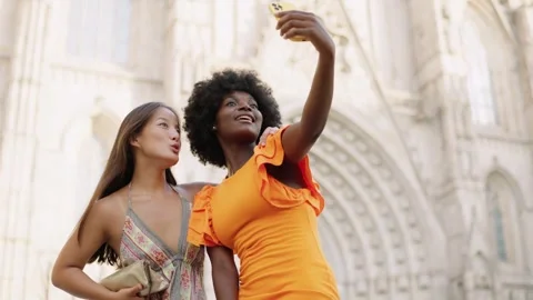 Multi-ethnic tourists taking a selfie while visiting a Church Stock Footage 255552845