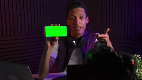 Multi-ethnic vlogger guy talking about smartphone application. Green screen. Video stock 147058063