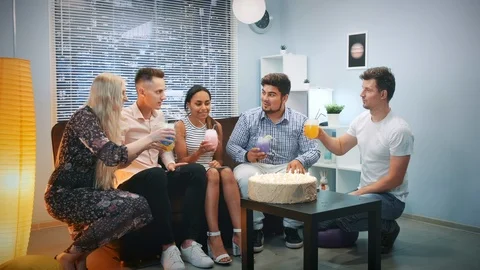 Multi-ethnic young people making toasts with dry ice cocktails on birthday party Video stock 112781926